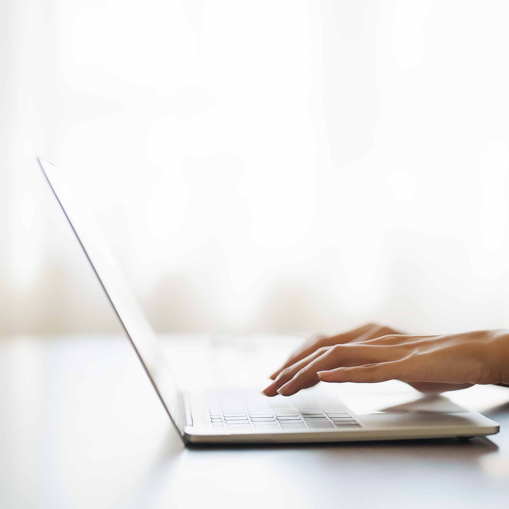 A woman searching on her laptop for "Free Parenting Classes in Lancaster, California"