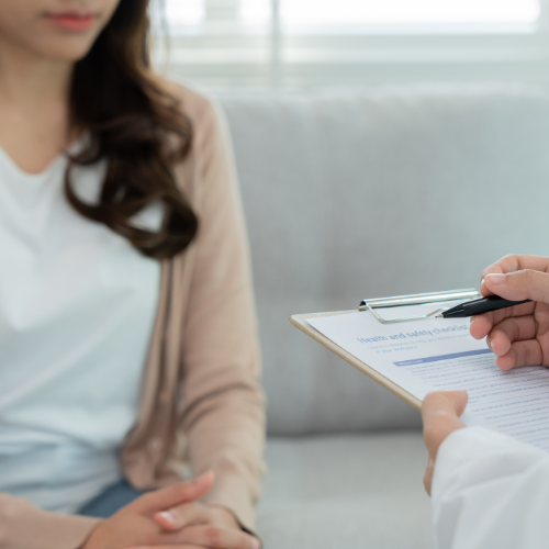 Woman asking doctor "When Should I Take a Pregnancy Test?"